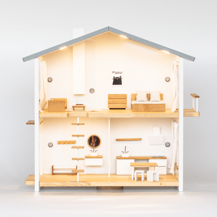 two storey dollhouse with light and furniture