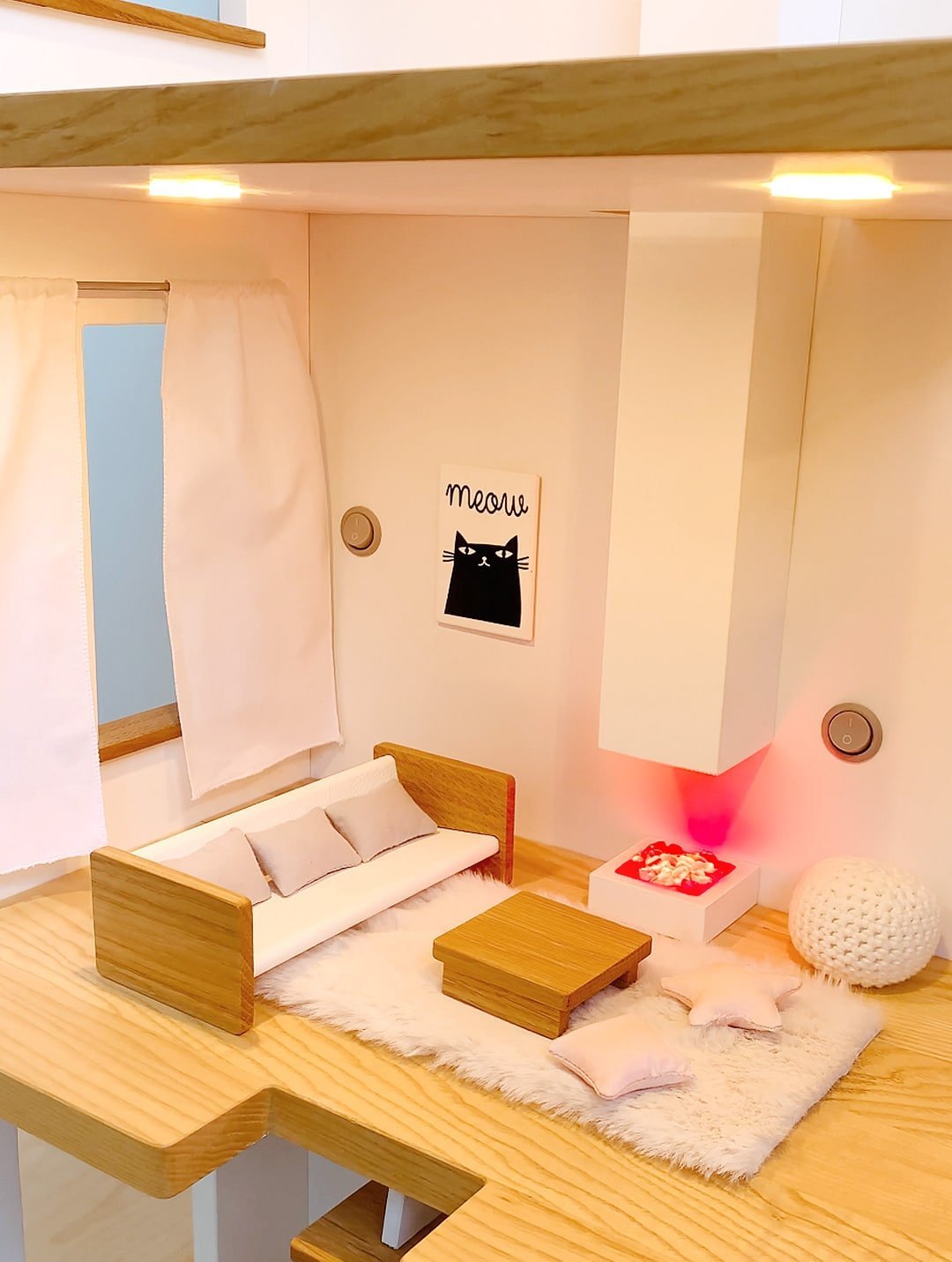 Katin Domik dollhouse living room with warm ceiling lights and glowing fireplace – sofa, coffee table and fluffy carpet