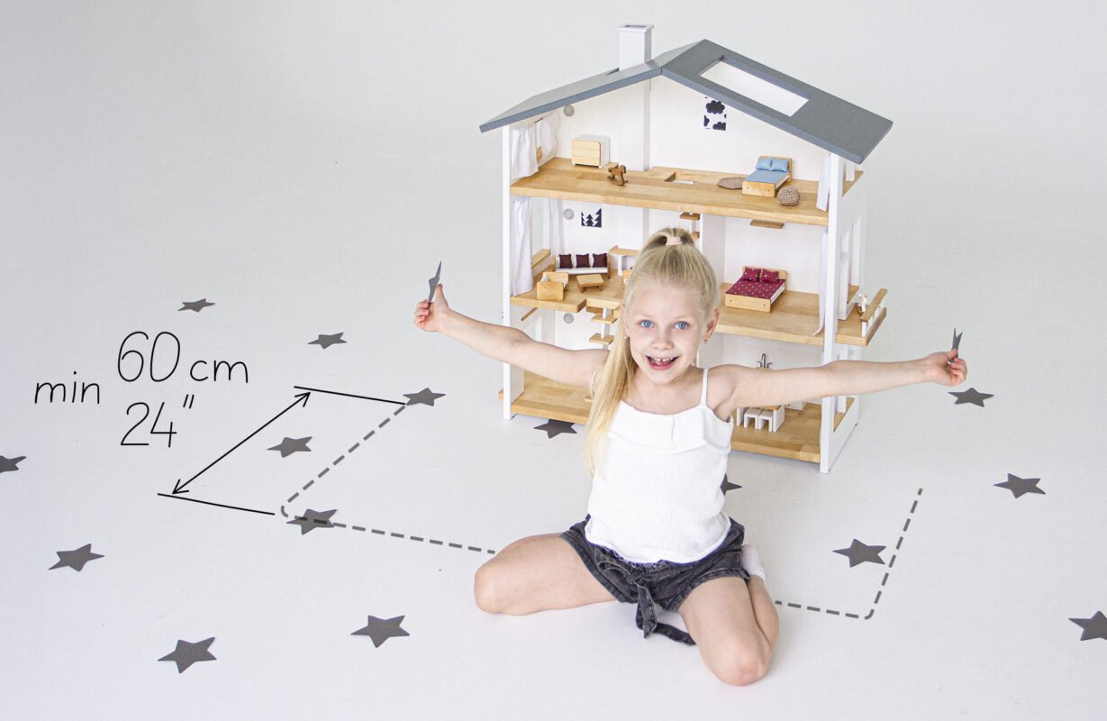Girl playing in front of Katin Domik three-story dollhouse — play zone depth min 60 cm (24 in) is part of overall dollhouse dimensions to plan for