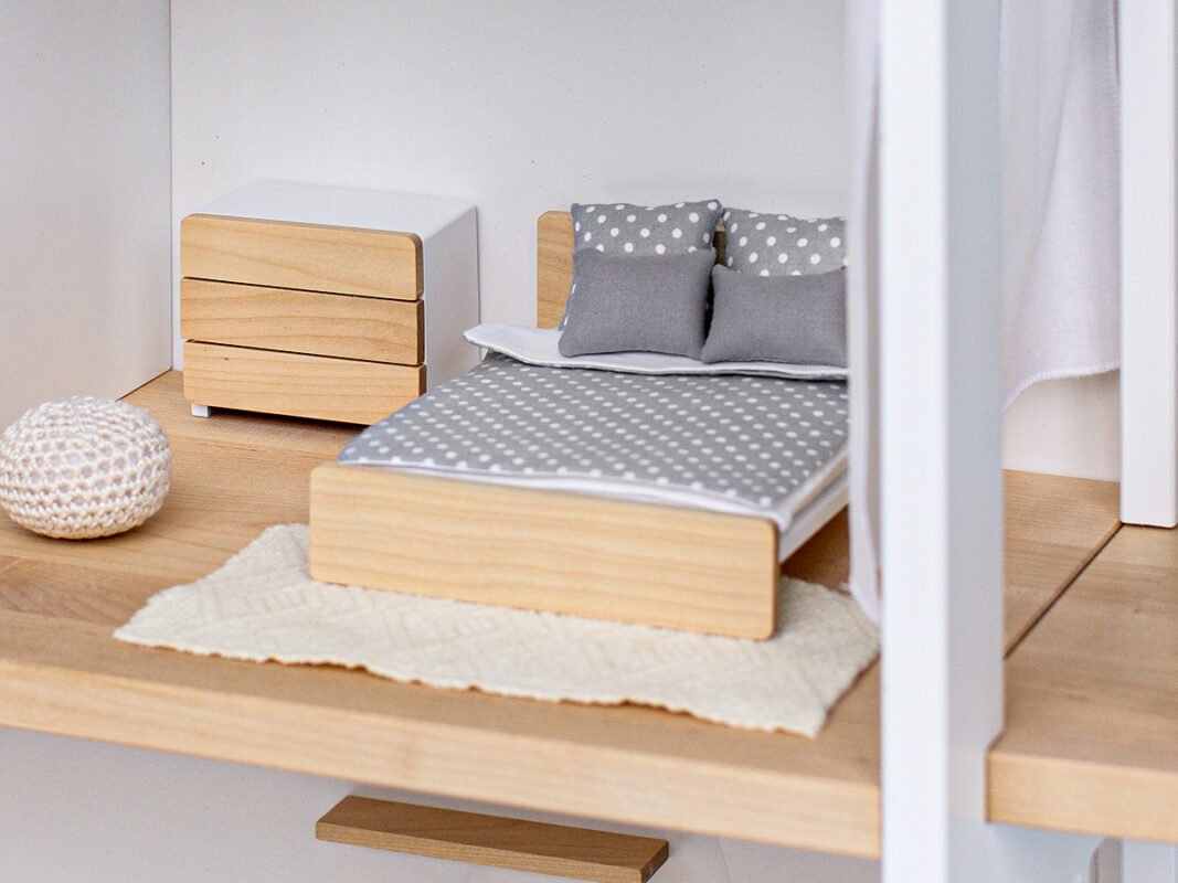 Katin Domik dollhouse bedroom — room depth fits a double bed, dresser, and rug with space to spare