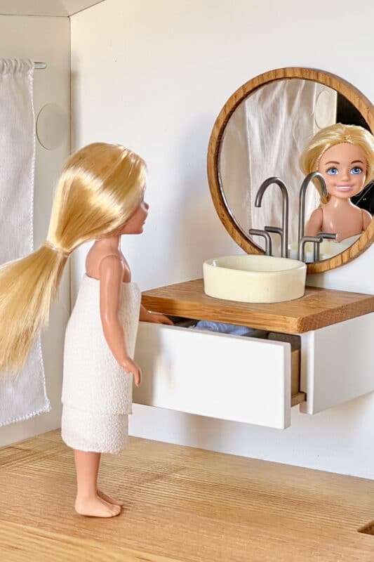 Chelsea doll in the bathroom of a 1:12 scale Katin-domik dollhouse